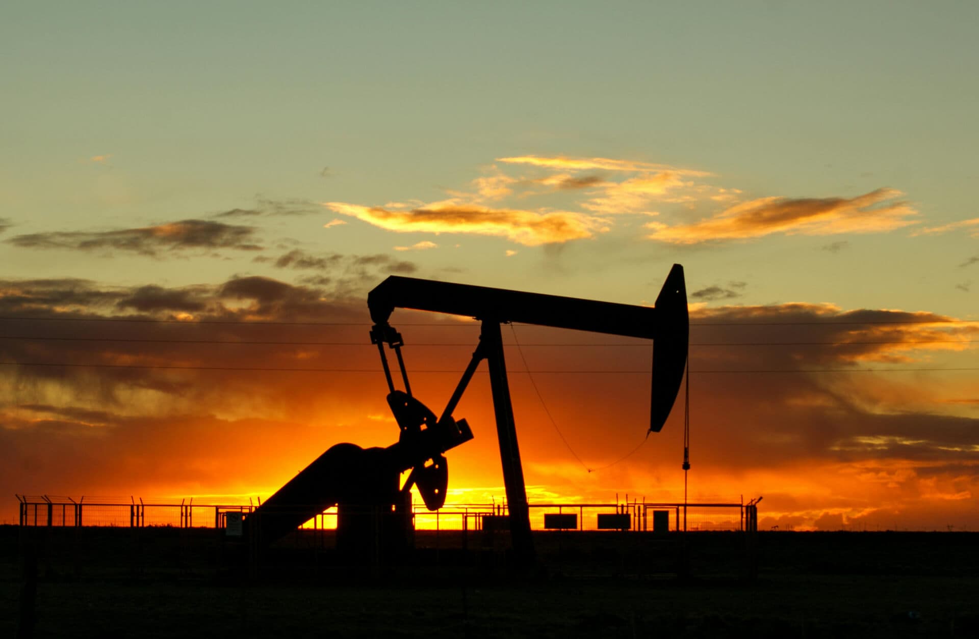 Oil pumpjack at sunset